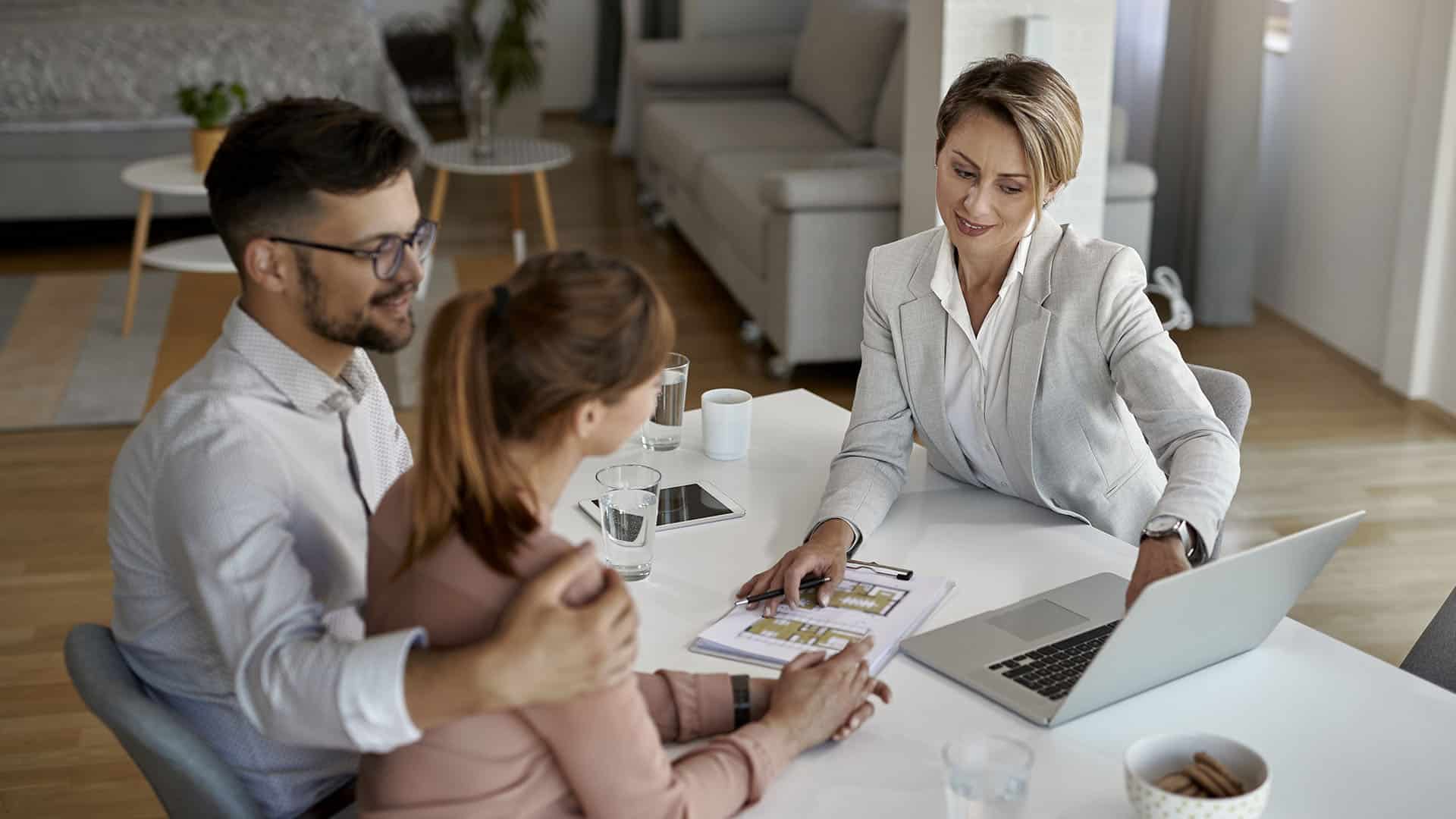 Realtor consulting with homeowners
